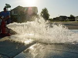 City employee flushing a fire hydrant