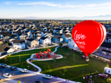 CBH red hot air balloon over homes