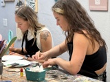 Two girls painting