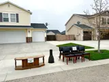 Gently used household items on the curb outside a residence with Trash or Treasure signs taped to them.